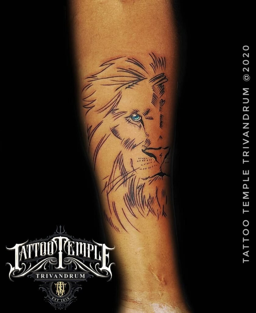 Minimalistic Style Line Art Lion Face with Blue Colour Eye Tattoo Design on Hand
