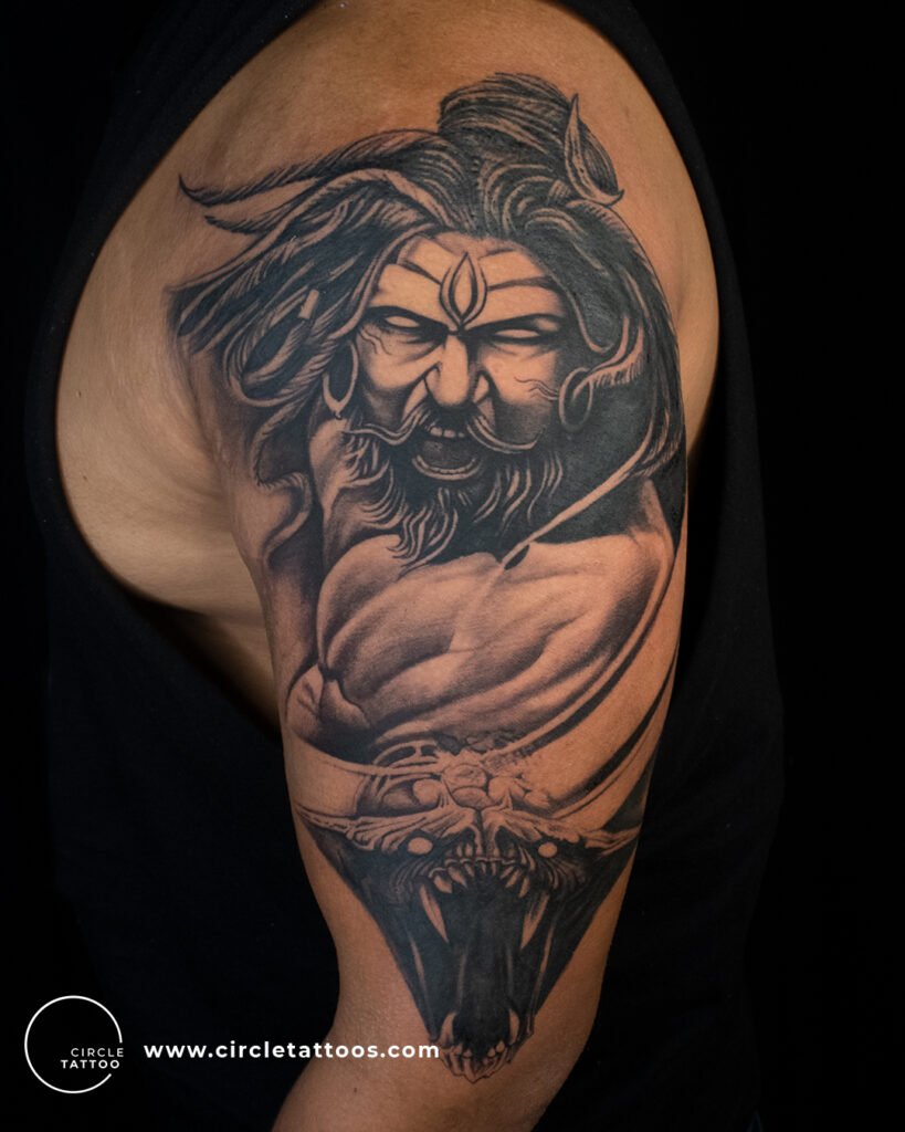 Angry Shiva Face Tattoo on Arm
