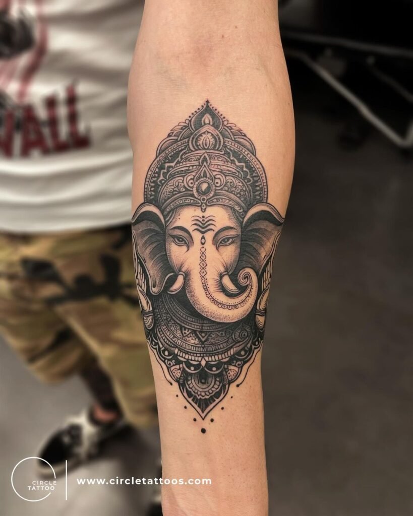 Dark Black Ganesh Tattoo Design on Forearms 
