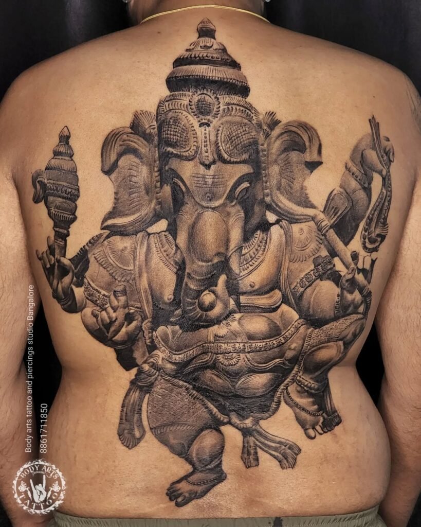 Wooden Idol Finish Realistic Style Ganpati Tattoo Design on Back