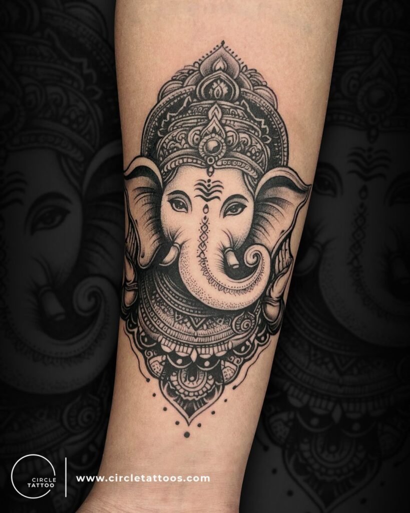 Thick Black Ganesh Tattoo on Forearms