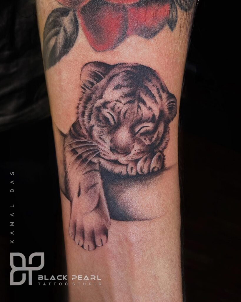 Cute and Simple Sleeping Baby Tiger Cub Tattoo Design on Hand - Realistic Style