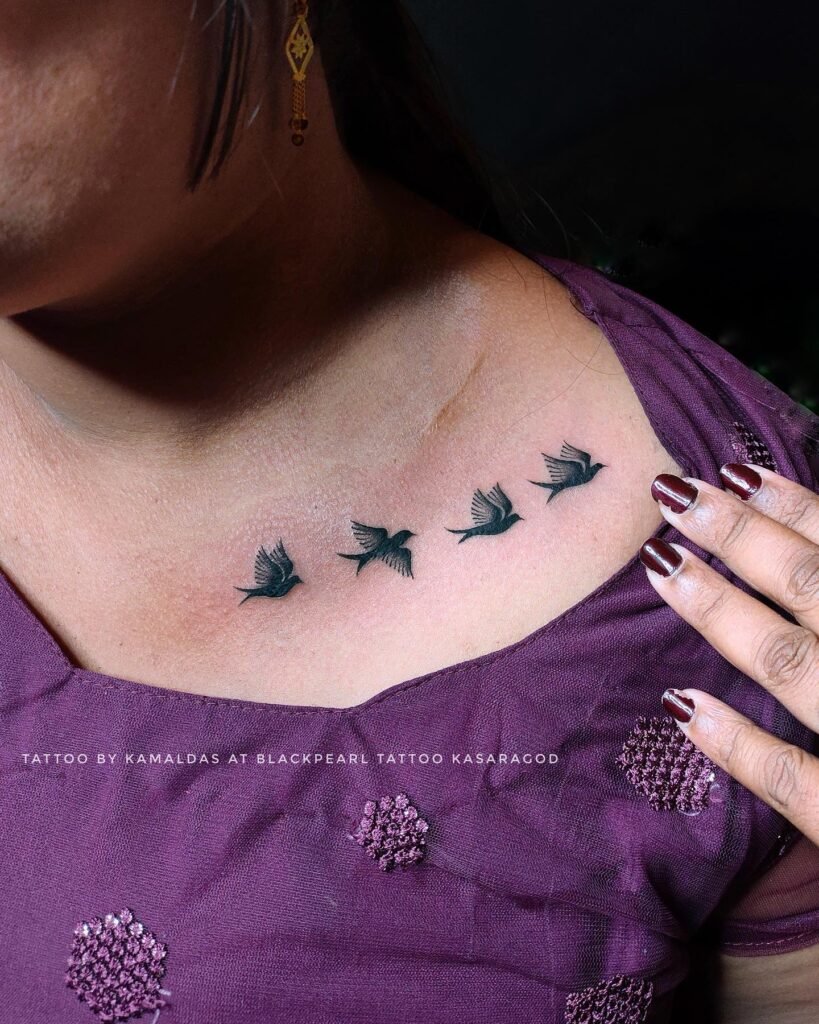 Minimalistic Flying Small Birds Front Neck Tattoo Design for Women
